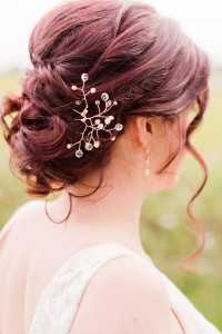 Bridal hair guide: Low loose bridal updo with rose gold crystal hair vine