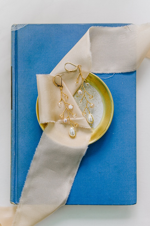 swarovski pearl and crystal branch earring flat lay jadorn designs custom jewelry