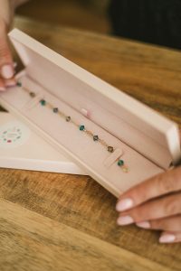 Reuse a jewelry box for safe travel - pro jewelry care advice from J'Adorn Designs gemstone jewelry