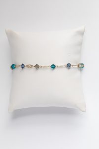 Delicate gold link and swarovski crystal bracelet in slate blue, teal, grey, and gold, handcrafted jewelry by J'Adorn Designs