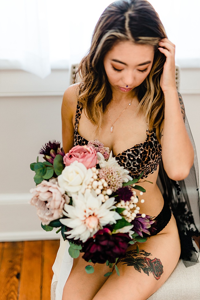 Styled boudoir photo featuring Asian woman in leopard and black lingerie with handcrafted crystal spike necklace by J'Adorn Designs fine art jewelry