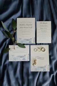 Classic wedding details featuring gold jewelry and artisan stationery in navy blue and white. Preppy nautical Annapolis wedding at Chesapeake Bay Beach Club featuring jewelry by J'Adorn Designs Maryland jewelry designer
