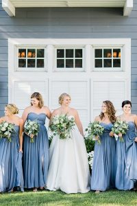 Bridal party portrait featuring blonde woman in sparkly gold bridal teardrop earrings by J'Adorn Designs bridal jeweler for a classic Annapolis wedding at Chesapeake Bay Beach Club