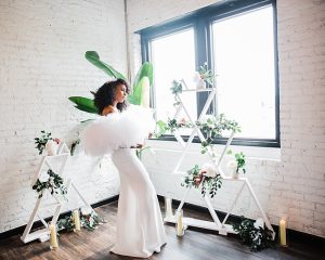 Urban botanical bridal style inspiration, natural hair black bride wearing dramatic raw crystal bridal comb by J'Adorn Designs artisan bridal accessories
