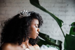 Urban botanical bridal style inspiration, natural hair black bride wearing dramatic raw crystal bridal comb by J'Adorn Designs artisan bridal accessories