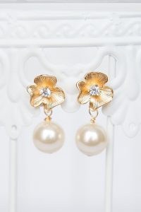 Posy and Pearl bridal earrings with matte gold flower and pearl drop, hypoallergenic post earrings for a wedding with sparkly flower center, made by J'Adorn Designs in Catonsville, Baltimore, Maryland