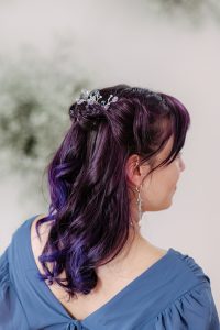 Amethyst and silver hair comb styled with a half up half down hairstyle for formal portraits. Handcrafted accessories by J'Adorn Designs.